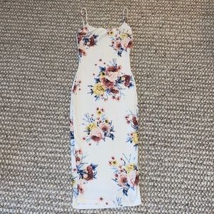 White floral dress. Size small. A little below the knees.